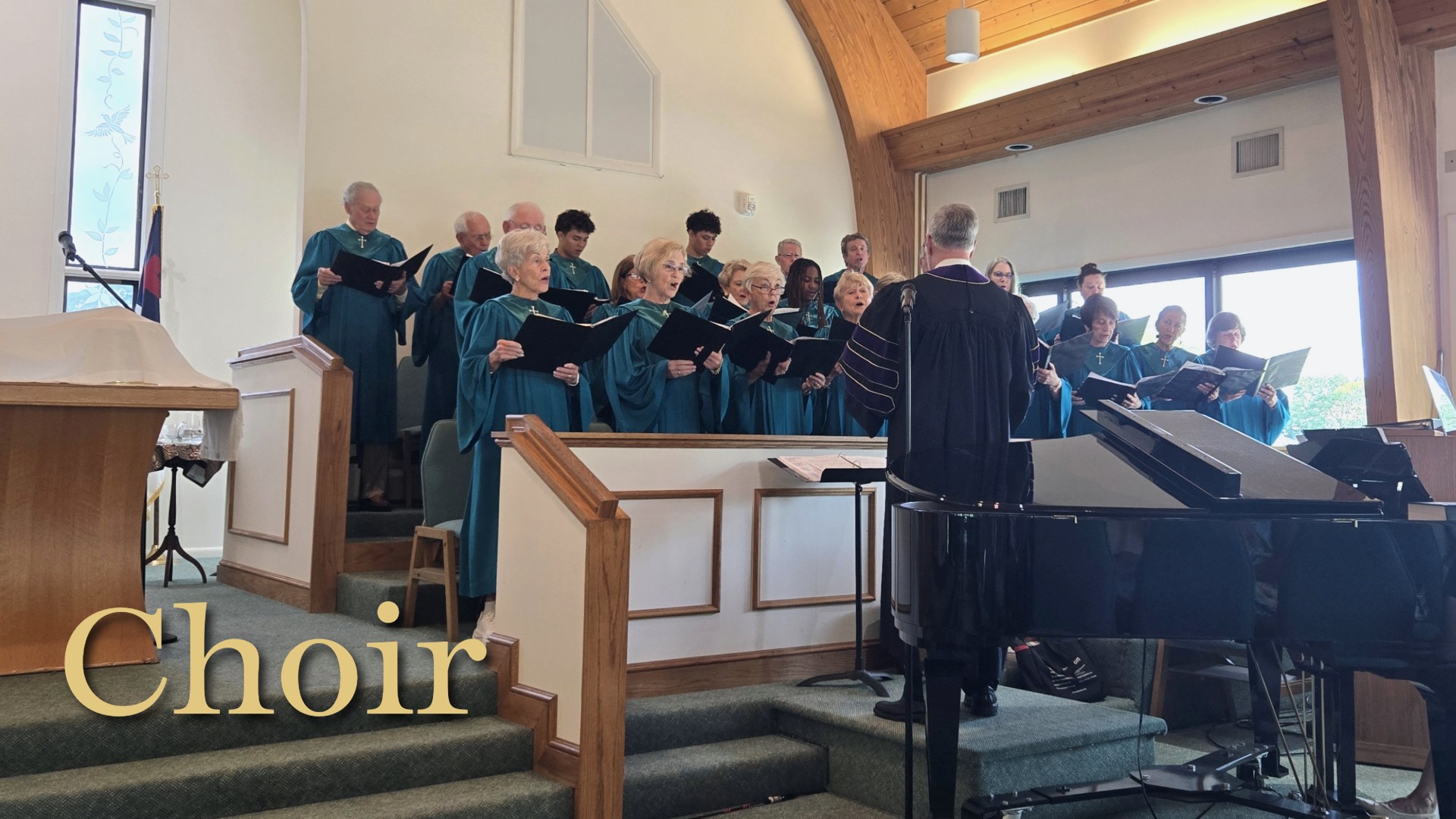 Dr. Jewett directing choir in worship service