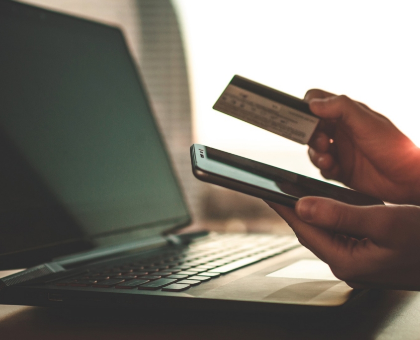 person using credit card to make an online donation