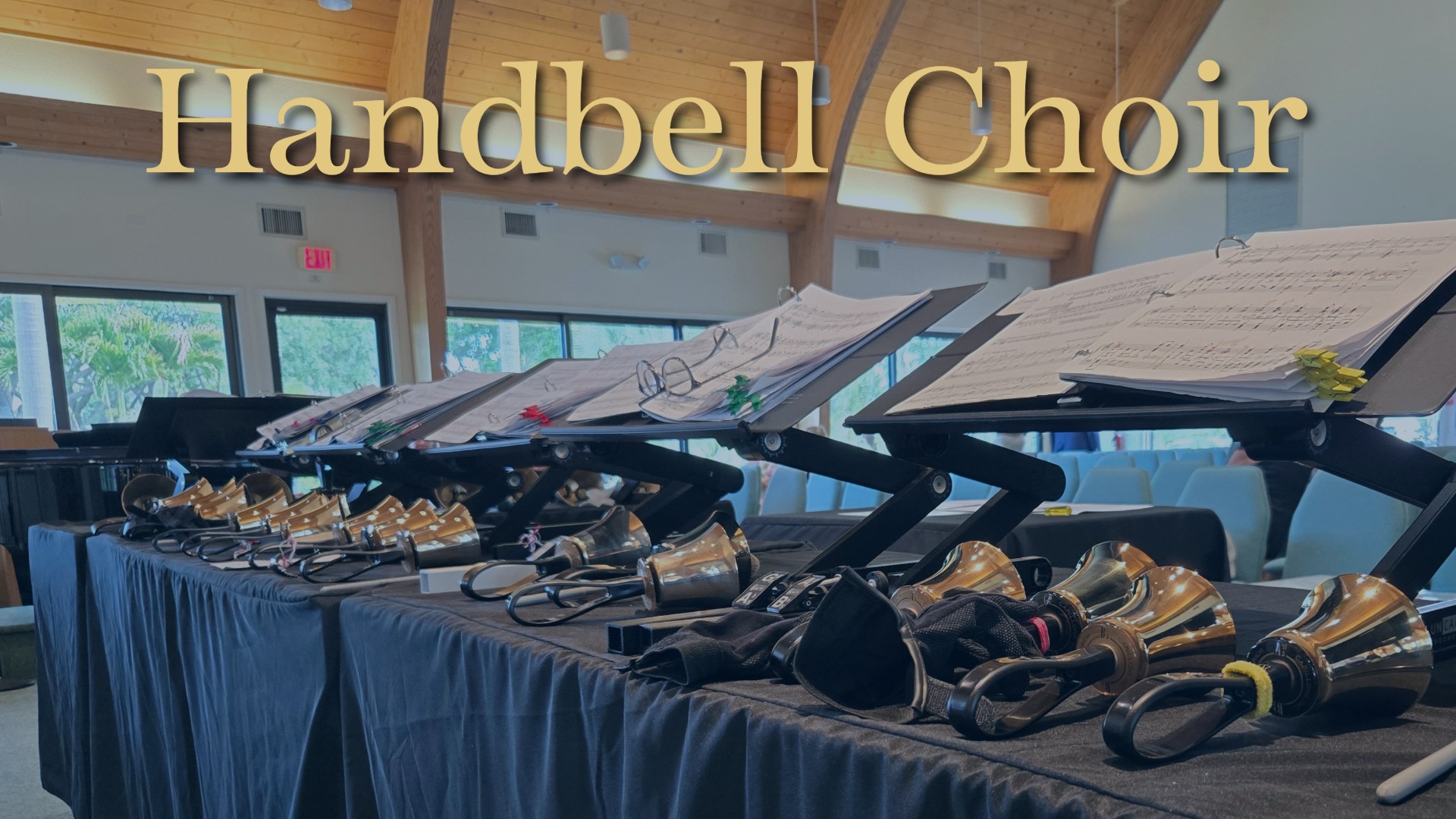 Row of handbells and sheet music across front of C hapel