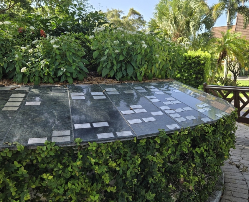 Close up of circular flower garden with plaques