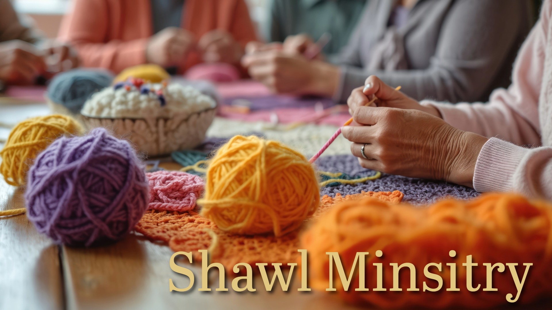 Ladies group knitting at table