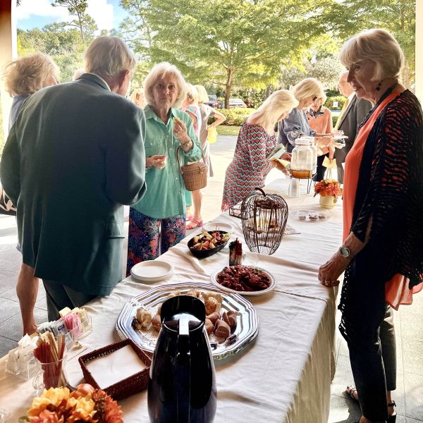 Lady serving coffee during reception after church