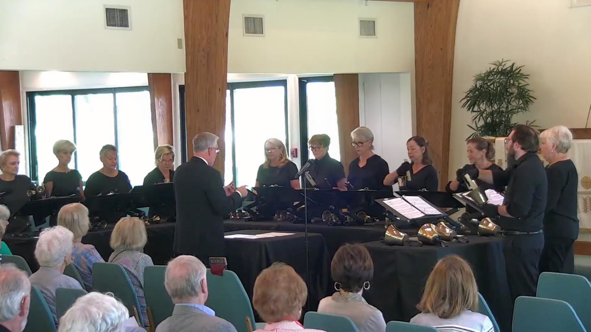 handbell choir playing in worship at chapel