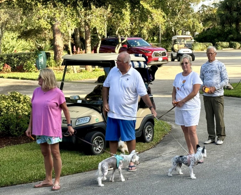 Two women and two men standing in line for pet prayer