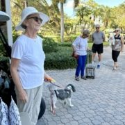 Sandy and Tucker handing out treat bags for pets