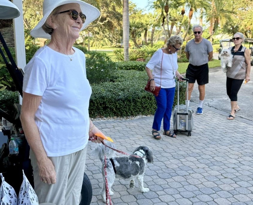 Sandy and Tucker handing out treat bags for pets