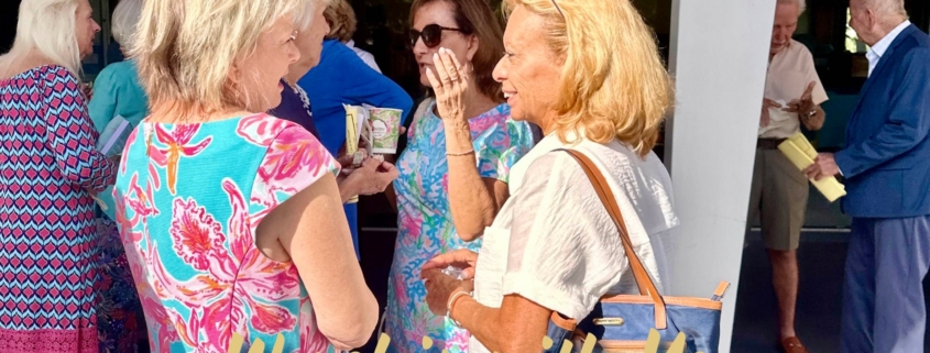 Ladies standing outside of chapel talking