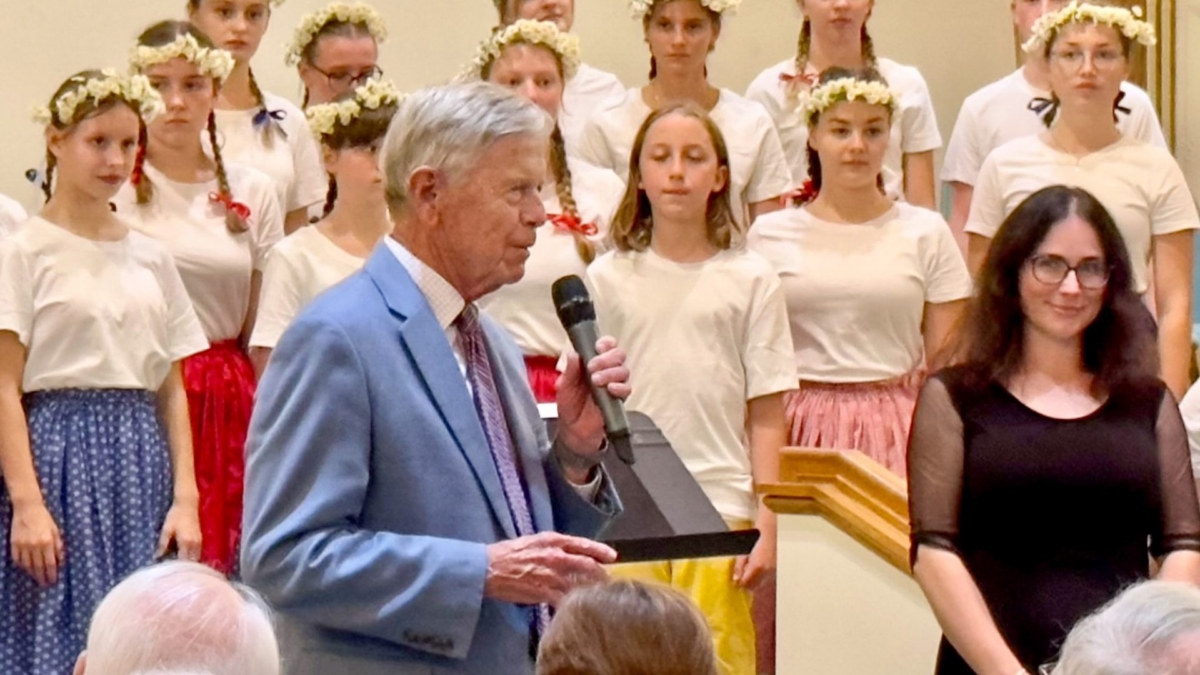 MC introducing all girls choir in chapel