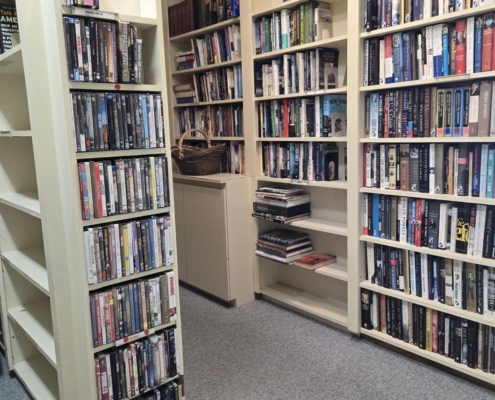 Library stacks Shelves of books and dvds in the community library