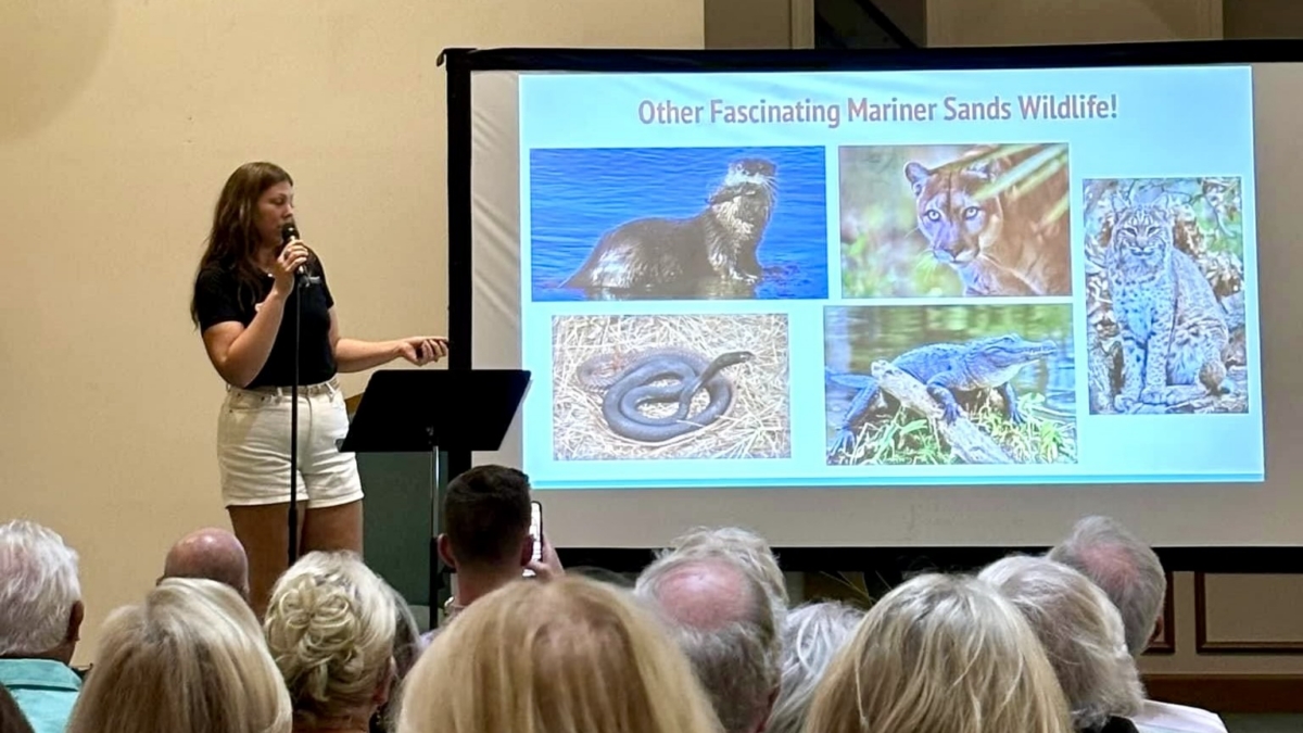 Membership at event Speaker at program showing slide of Mariner Sands wildlife